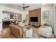 Stylish living room open to kitchen and dining area, features wood accent wall and sliding door to outdoor patio at 3026 Kalex Ct, Charlotte, NC 28204