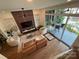 Overhead view of living room featuring plush seating, ceiling fan, and a sliding door to a patio at 3026 Kalex Ct, Charlotte, NC 28204