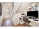 Cozy office area with built-in shelves, desk, and natural light near stairs at 3026 Kalex Ct, Charlotte, NC 28204