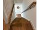 Hardwood staircase with natural light cascading down from above at 3026 Kalex Ct, Charlotte, NC 28204