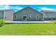 Backyard with a large concrete patio, green grass, and privacy fencing at 3207 Selwyn Landing Dr, Charlotte, NC 28215