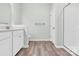 Bright bathroom featuring tile flooring, white cabinets and a glass enclosed shower at 3207 Selwyn Landing Dr, Charlotte, NC 28215