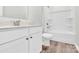 Clean bathroom featuring a bathtub with shower, toilet, white vanity, and hardwood floors at 3207 Selwyn Landing Dr, Charlotte, NC 28215
