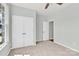 Serene bedroom with carpet, a ceiling fan, double door closet, and a window offering natural light at 3207 Selwyn Landing Dr, Charlotte, NC 28215