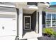 Inviting front entrance featuring white columns and a black front door, showcasing a welcoming facade at 3207 Selwyn Landing Dr, Charlotte, NC 28215