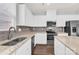 Modern kitchen featuring white cabinets, stainless steel appliances, and granite countertops at 3207 Selwyn Landing Dr, Charlotte, NC 28215