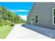 Home's extended concrete patio offers outdoor living and entertaining space at 3207 Selwyn Landing Dr, Charlotte, NC 28215