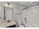 Bathroom with a vanity, shower-tub combo, and neutral color palette at 321 Almora Loop, Mooresville, NC 28115