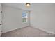 A bedroom featuring carpet flooring, neutral walls, and natural light at 321 Almora Loop, Mooresville, NC 28115