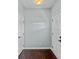 Clean and bright foyer with hardwood floors, white trim, and coat hooks at 321 Almora Loop, Mooresville, NC 28115