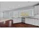 Modern kitchen with stainless steel appliances, granite countertops, and an open view to the breakfast area at 321 Almora Loop, Mooresville, NC 28115