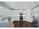 Well-equipped kitchen featuring white cabinets, stainless steel appliances, and granite countertops at 321 Almora Loop, Mooresville, NC 28115