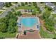 Birds eye view of community pool with lounge chairs, tables, and playground nearby at 321 Almora Loop, Mooresville, NC 28115