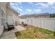 Cozy backyard with a small patio area, complete with a chair and a white fence surrounding the space at 3561 Calpella Ct, Charlotte, NC 28262