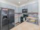 Efficient kitchen with updated appliances and colorful backsplash at 3561 Calpella Ct, Charlotte, NC 28262