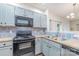 Bright kitchen featuring updated appliances and colorful backsplash at 3561 Calpella Ct, Charlotte, NC 28262