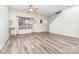 Inviting living room featuring light hardwood floors, neutral walls, and a ceiling fan at 3561 Calpella Ct, Charlotte, NC 28262