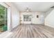 Bright and airy living room with new hardwood floors, ceiling fan and natural light at 3561 Calpella Ct, Charlotte, NC 28262