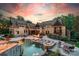 Stunning backyard with a luxurious pool, spa, fire pit, and ample seating for entertaining at 3587 Ridgetop Rd, Sherrills Ford, NC 28673