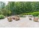 Backyard patio with multiple seating areas, a stone firepit, and a waterfall pool feature at 3587 Ridgetop Rd, Sherrills Ford, NC 28673