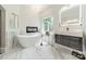 Bright bathroom with soaking tub, marble floors, and modern vanity with elegant fixtures for relaxation at 3587 Ridgetop Rd, Sherrills Ford, NC 28673
