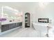 Bright bathroom with soaking tub, fireplace, marble floors, and modern vanity with elegant fixtures for relaxation at 3587 Ridgetop Rd, Sherrills Ford, NC 28673