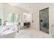 Luxurious bathroom with soaking tub, marble floors, and elegant fixtures for a spa-like experience at 3587 Ridgetop Rd, Sherrills Ford, NC 28673