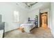 Cozy bedroom with light walls, carpet flooring, and a decorative ceiling fan at 3587 Ridgetop Rd, Sherrills Ford, NC 28673
