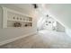 Spacious bonus room with built-in shelving, skylights, and ample space for recreation or relaxation at 3587 Ridgetop Rd, Sherrills Ford, NC 28673