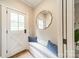 Cozy entryway with a white door, built-in bench, mirror, and storage for a warm welcome at 3587 Ridgetop Rd, Sherrills Ford, NC 28673