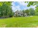 Beautiful custom home on sprawling green lawn with mature landscaping at 3587 Ridgetop Rd, Sherrills Ford, NC 28673