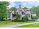 Beautiful custom home on sprawling green lawn with mature landscaping at 3587 Ridgetop Rd, Sherrills Ford, NC 28673