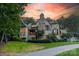 Charming exterior view of home with stone accents, lush landscaping and a well-manicured lawn at 3587 Ridgetop Rd, Sherrills Ford, NC 28673