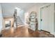 Inviting foyer with hardwood floors, staircase, and decorative console table at 3587 Ridgetop Rd, Sherrills Ford, NC 28673
