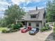 Stunning home with a stone exterior, detailed roof, and a spacious driveway featuring two luxury cars at 3587 Ridgetop Rd, Sherrills Ford, NC 28673