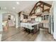 Spacious kitchen features a large island, stone pillar, stainless steel appliances, and a vaulted ceiling at 3587 Ridgetop Rd, Sherrills Ford, NC 28673