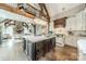 Open concept kitchen featuring a large center island, custom cabinets, and an open view of the living room at 3587 Ridgetop Rd, Sherrills Ford, NC 28673