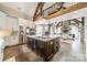 Bright kitchen featuring custom cabinets, an island, an eat in bar, and an open concept to the living room at 3587 Ridgetop Rd, Sherrills Ford, NC 28673