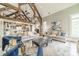 Spacious living room with exposed beams, vaulted ceilings, and an open layout to the kitchen for gatherings at 3587 Ridgetop Rd, Sherrills Ford, NC 28673