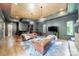 Open-concept living room with hardwood floors, fireplace, bar, and neutral color palette at 3587 Ridgetop Rd, Sherrills Ford, NC 28673