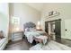 Comfortable main bedroom features a vaulted ceiling, bench and a decorative barn door to the ensuite at 3587 Ridgetop Rd, Sherrills Ford, NC 28673