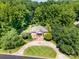 Aerial view of an elegant home surrounded by lush greenery, showcasing its private setting at 408 Johnsfield Rd, Shelby, NC 28150