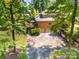 Aerial view of a well-maintained property with a large backyard, deck, and driveway at 408 Johnsfield Rd, Shelby, NC 28150
