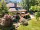 Aerial view of a large backyard with a deck, staircase, and meticulously maintained landscaping at 408 Johnsfield Rd, Shelby, NC 28150