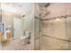 Tiled bathroom with glass shower, vanity, and toilet at 408 Johnsfield Rd, Shelby, NC 28150