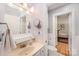 Bright bathroom with a single vanity, toilet, and view to an adjoining bedroom at 408 Johnsfield Rd, Shelby, NC 28150