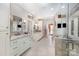 Bright bathroom featuring double sinks, granite countertops, and glass shower at 408 Johnsfield Rd, Shelby, NC 28150
