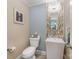 Stylish half bathroom features a decorative backsplash, pedestal sink, and mosaic tile floor at 408 Johnsfield Rd, Shelby, NC 28150