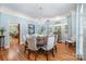 Elegant dining room with hardwood floors, chandelier, and large windows with lots of light at 408 Johnsfield Rd, Shelby, NC 28150