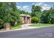 Charming brick home with lush landscaping and a circular driveway creates great curb appeal at 408 Johnsfield Rd, Shelby, NC 28150